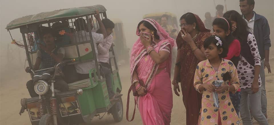 Indians cover their faces amid thick fog in the capital New Delhi. The Supreme Court has banned the use of firecrackers during the Hindu festival of Diwali because of pollution concerns. Photo: EPA